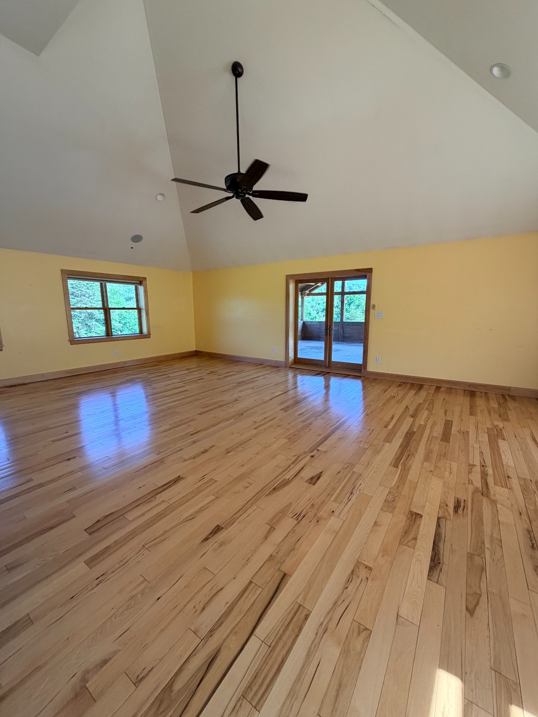 Empty room with vaulted ceiling mid-renovation